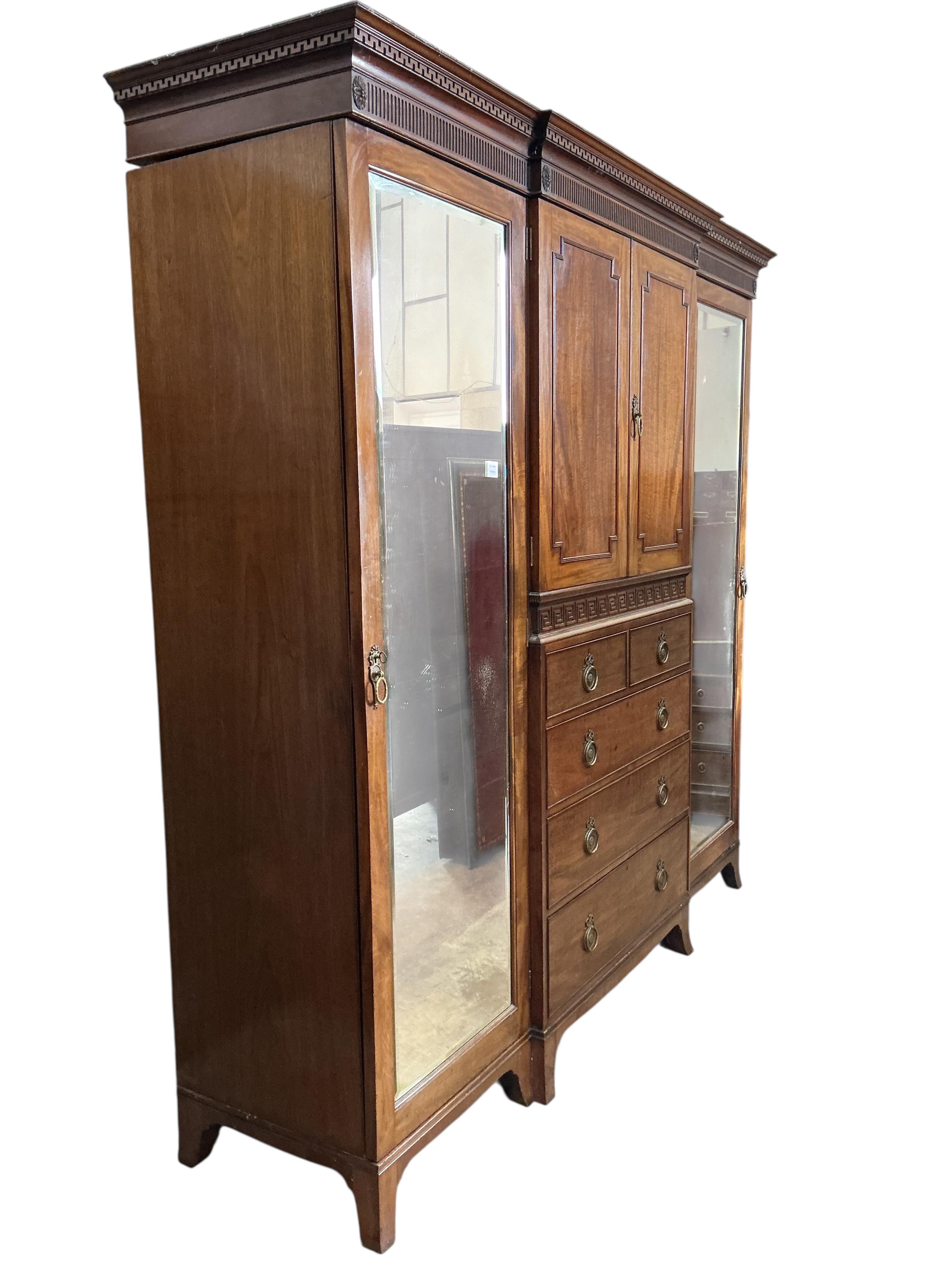 An early 20th century Heal & Son mahogany mirrored compactum wardrobe, width 224cm, depth 58cm, height 215cm
